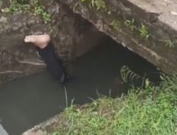 Warga Mimika Dikejutkan Penemuan Pria Berbaju Hitam Tewas Terendam di Saluran Drainase